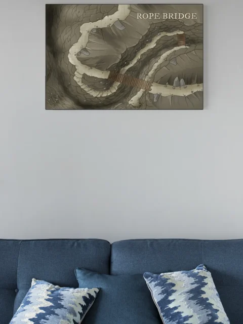 Top-down fantasy map showing a rope bridge between cliffs