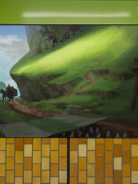 Group of creatures running along a steep grassy hill