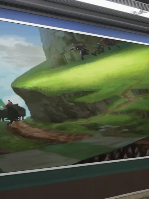 Travelers on a winding path beneath looming cliffs