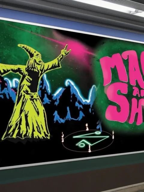 Robe-clad wizard raising arms during a spell