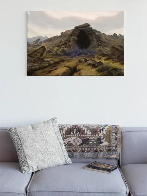 Shadowed cave opening beneath piled stones