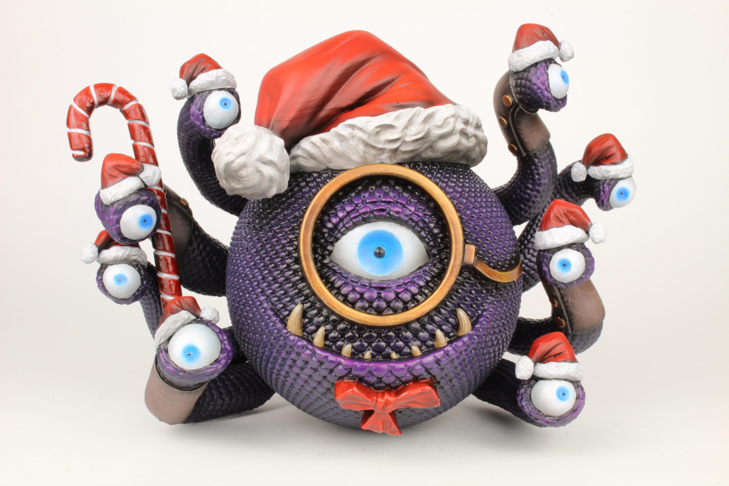 Front view of Dandy Claus wearing festive cap and ornament accents