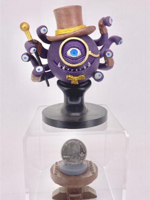 Three-quarter angle showing layered mechanical ornament and base