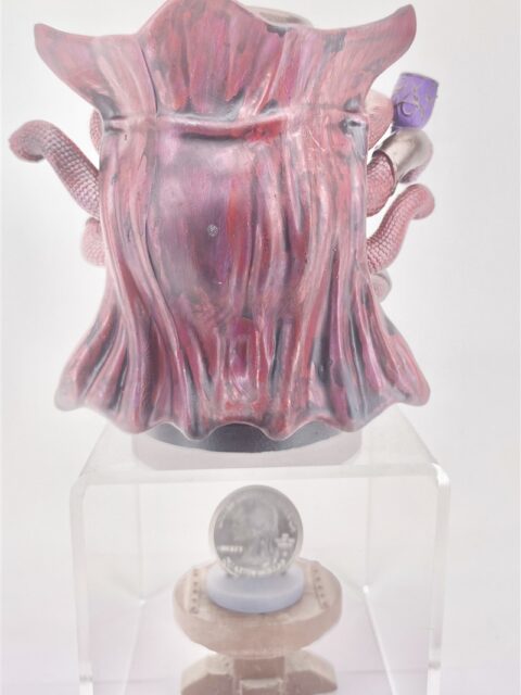 Rear view highlighting sculpted cape contours