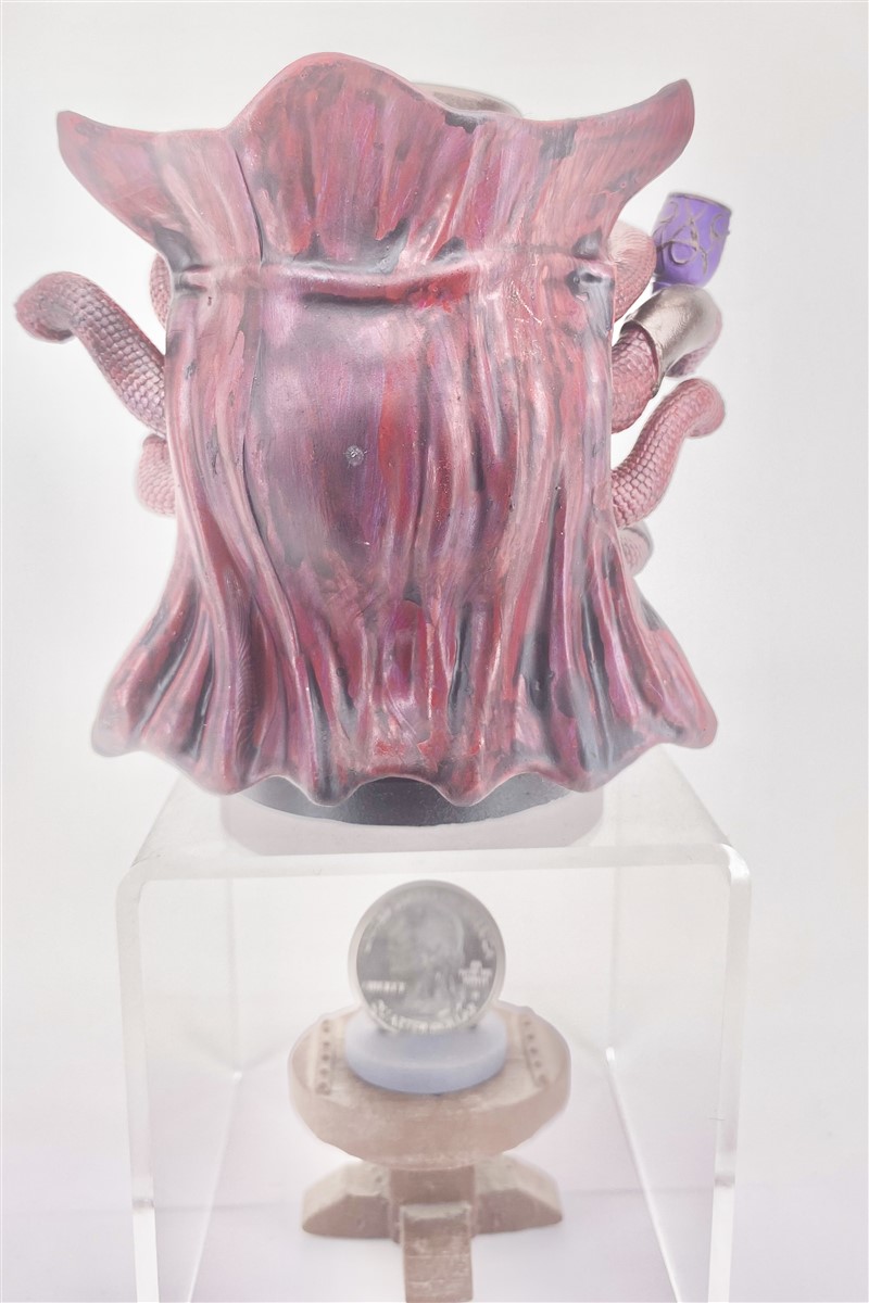 Rear view highlighting sculpted cape contours