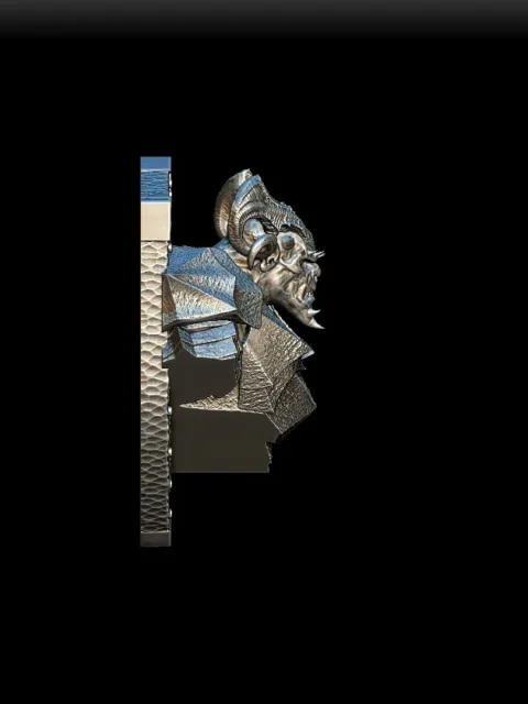 Right Profile highlighting curved horn structure and sharp cheek ridges