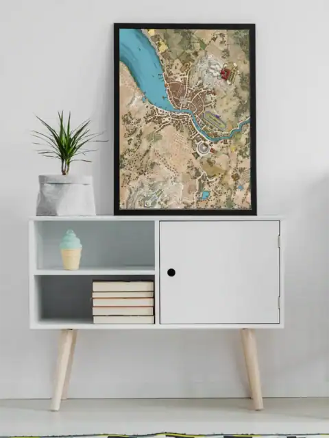 Hand-drawn fantasy map showing coastal settlement split by bright turquoise river.