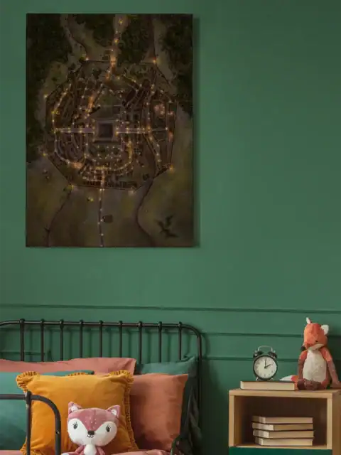 Hand-drawn fantasy city map viewed from above showing walled settlement.